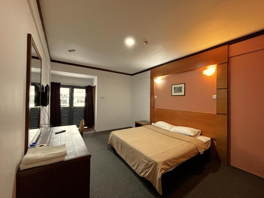 Postel nebo postele na pokoji v ubytování Cool Point Hotel