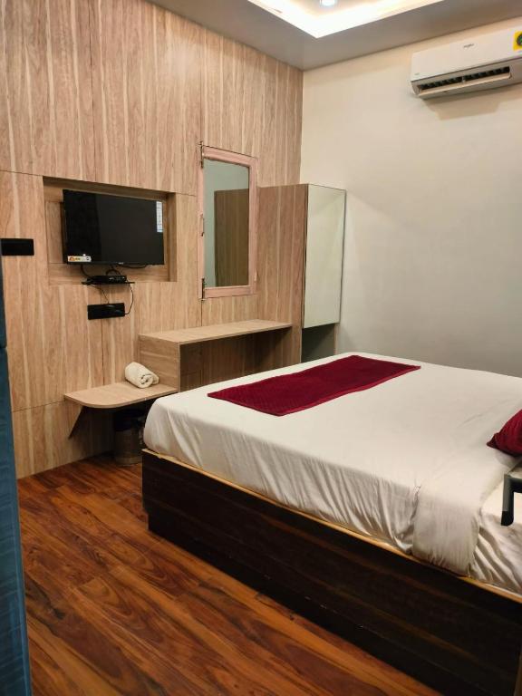 Postel nebo postele na pokoji v ubytování Hotel Anand Villa