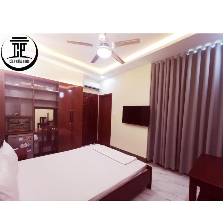 KHÁCH SẠN CÚC PHƯƠNG - Deluxe Queen Room Con Due Letti Matrimoniali