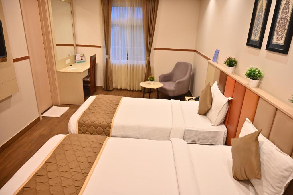 Postel nebo postele na pokoji v ubytování Soho Boutique Hotel