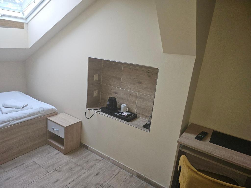 Łóżko lub łóżka w pokoju w obiekcie Hotel Taurus