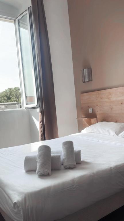 Postel nebo postele na pokoji v ubytování Hotel Riviera