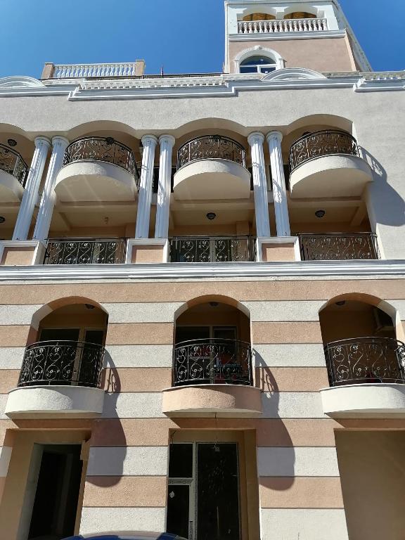 a building with two balconies on the side of it at Belisima 204 B in Ravda