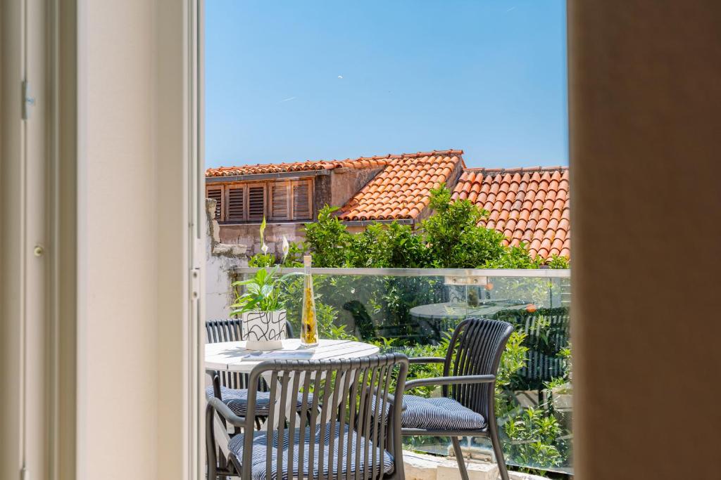 a table and chairs on a balcony with a view at Apartment Jessica in Korčula