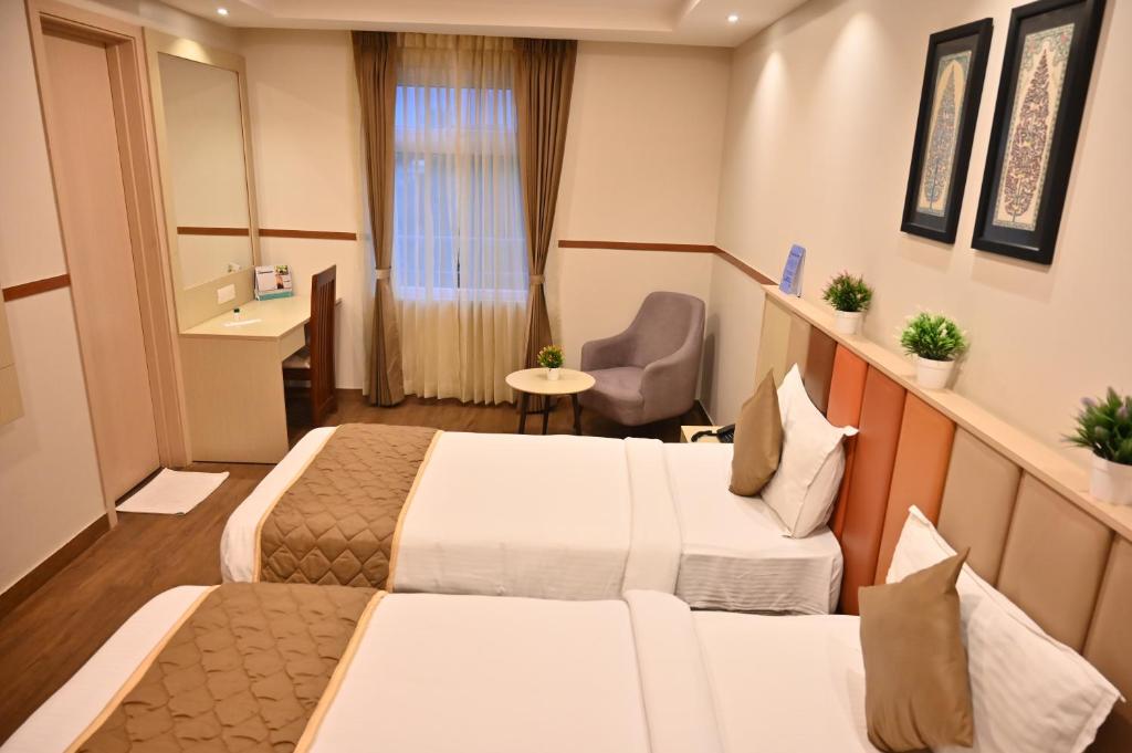 Postel nebo postele na pokoji v ubytování Soho Boutique Hotel