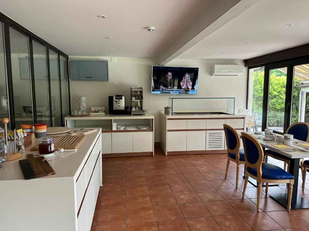 Kuchyň nebo kuchyňský kout v ubytování Hotel Tiziana