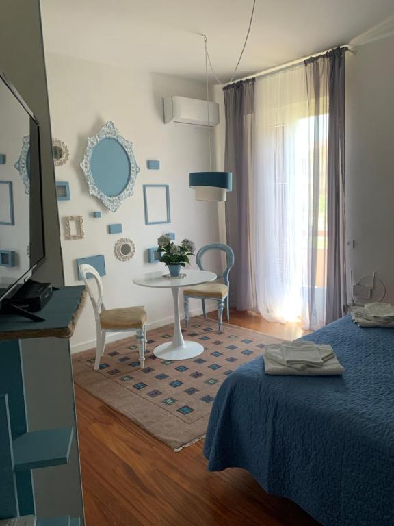 Postel nebo postele na pokoji v ubytování Casa di Lucia B&B