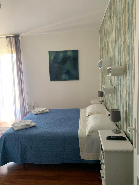 Postel nebo postele na pokoji v ubytování Casa di Lucia B&B