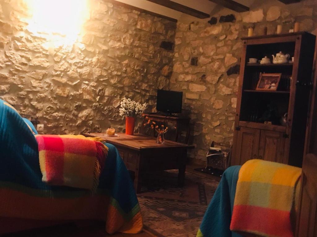 TV a/nebo společenská místnost v ubytování Hostal La Muralla
