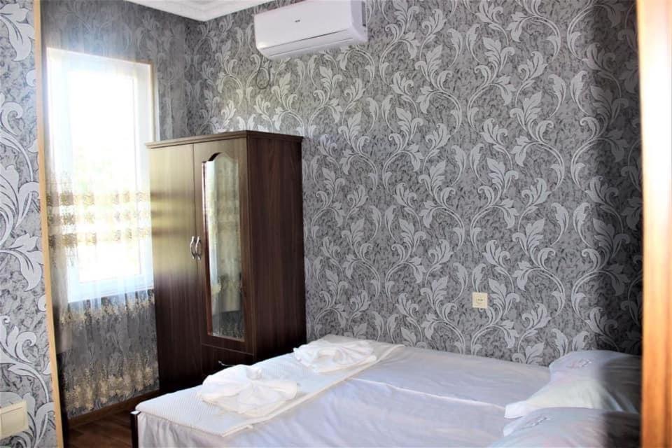 Postel nebo postele na pokoji v ubytování Hotel Oniks