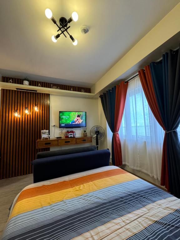 TV a/nebo společenská místnost v ubytování Condo Home with fast wifi in Bacolod City