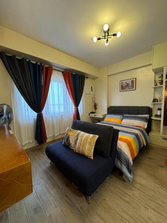 Postel nebo postele na pokoji v ubytování Condo Home with fast wifi in Bacolod City