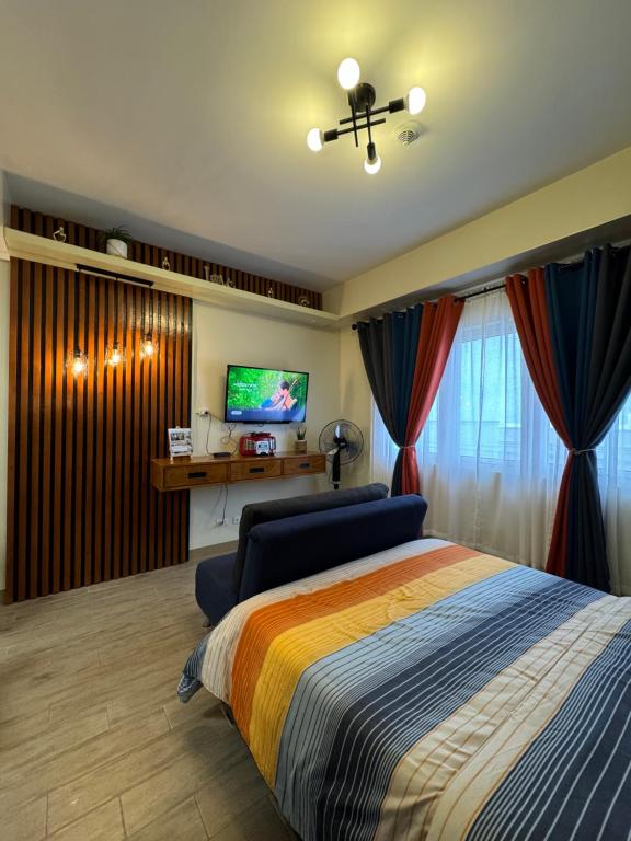 TV a/nebo společenská místnost v ubytování Condo Home with fast wifi in Bacolod City