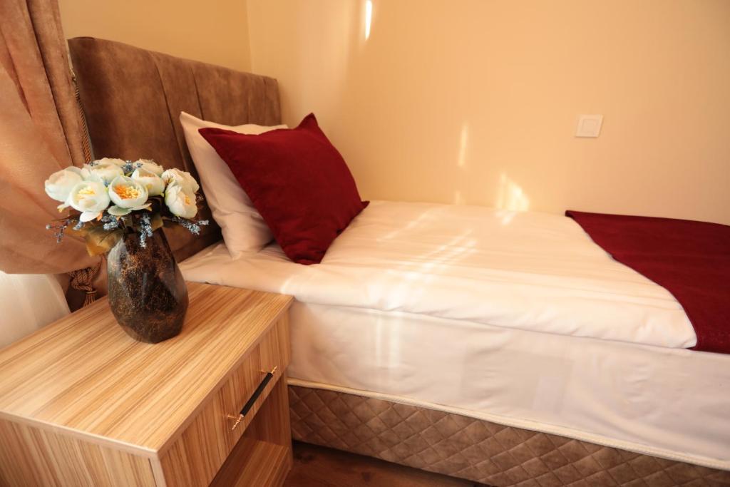 A bed or beds in a room at Gülec Konak Hotel
