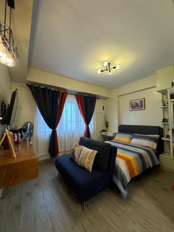 Postel nebo postele na pokoji v ubytování Condo Home with fast wifi in Bacolod City