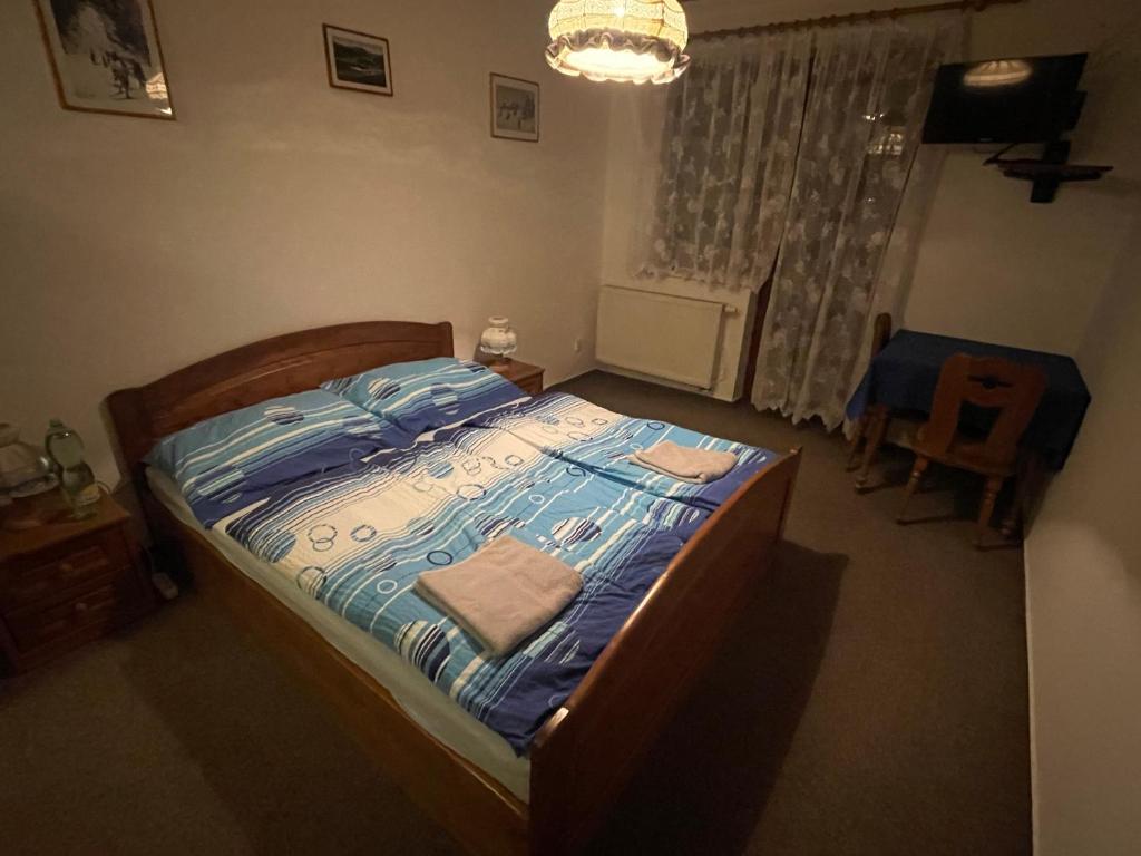 Postel nebo postele na pokoji v ubytování Pension Luscinia