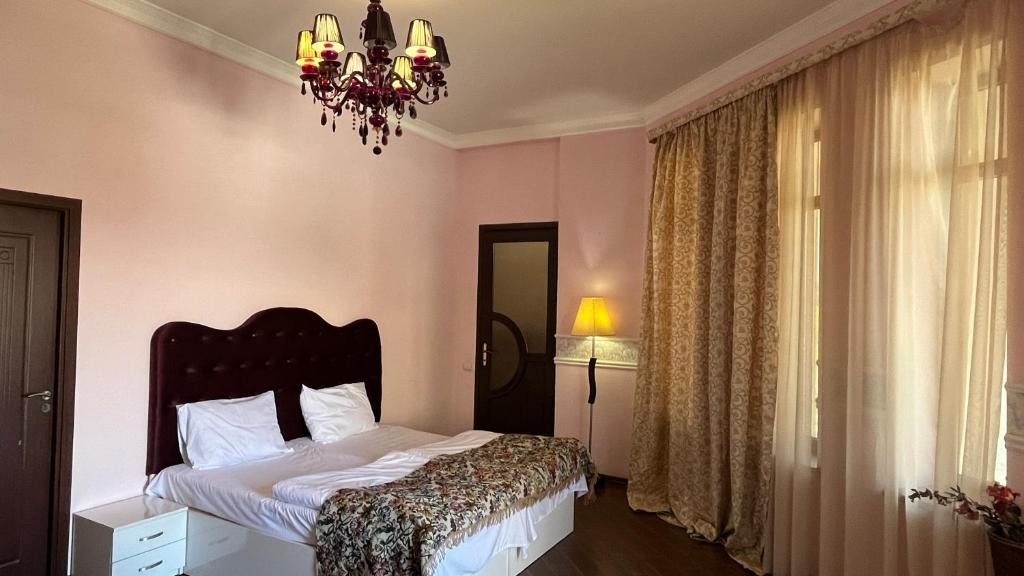 Postel nebo postele na pokoji v ubytování Ivy Boutique Hotel