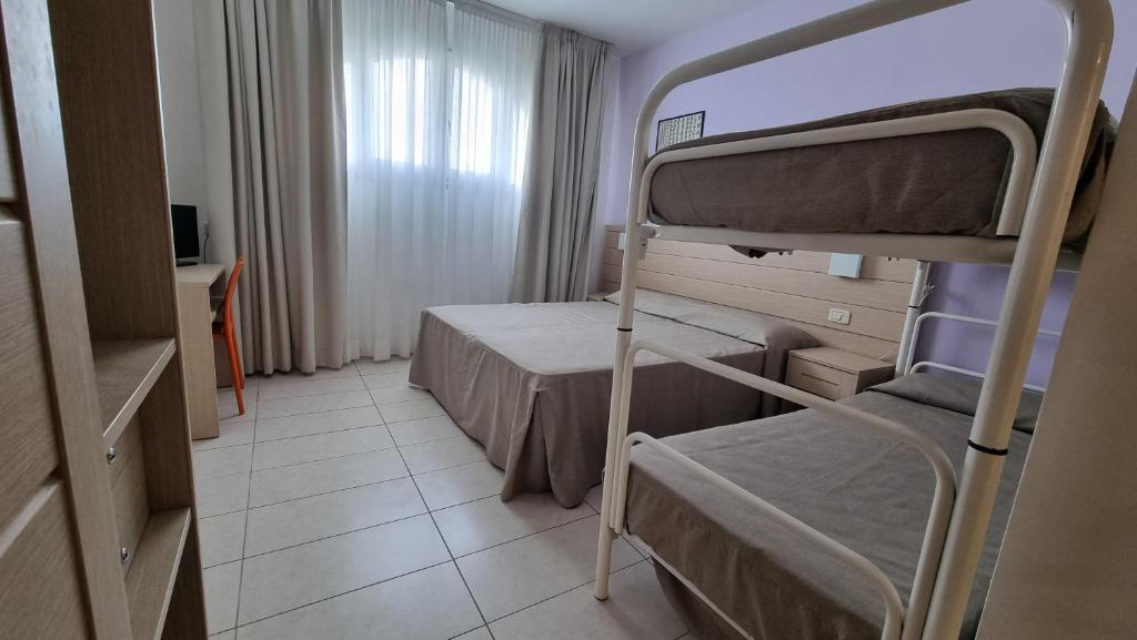 Postel nebo postele na pokoji v ubytování Gargano Hotel Helios