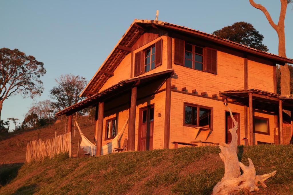 a house sitting on top of a hill at Chalés Samadhi in Cunha