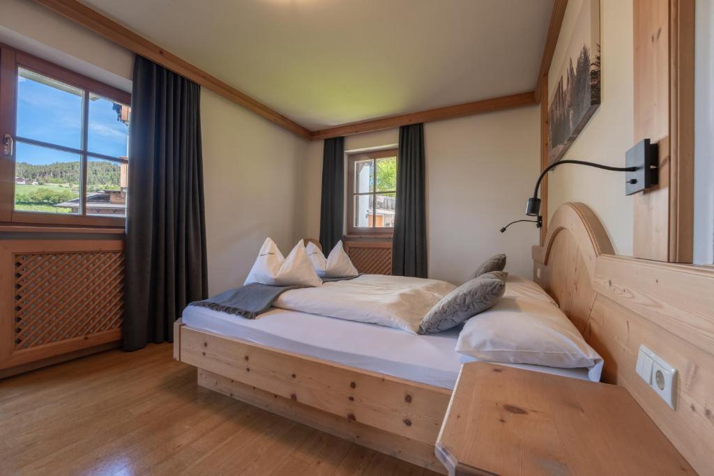Postel nebo postele na pokoji v ubytování Residence Burghof