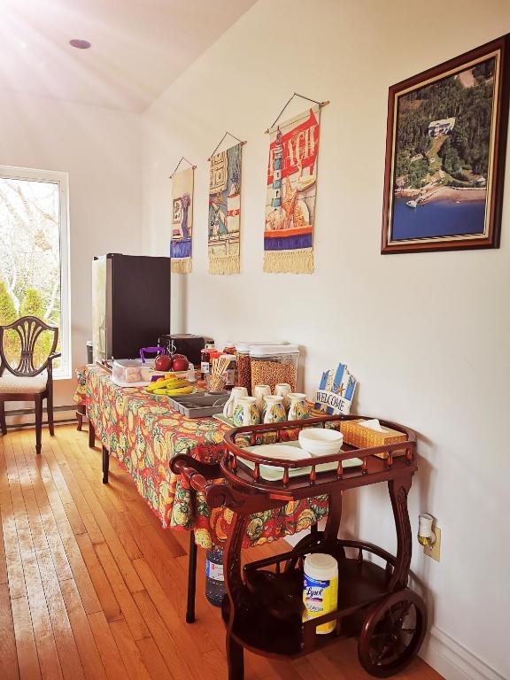 a room with a table with food on it at 181 Oceanside Inn in Peggy's Cove