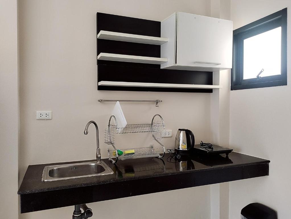 Kuchyň nebo kuchyňský kout v ubytování Villa LunaSole Samui