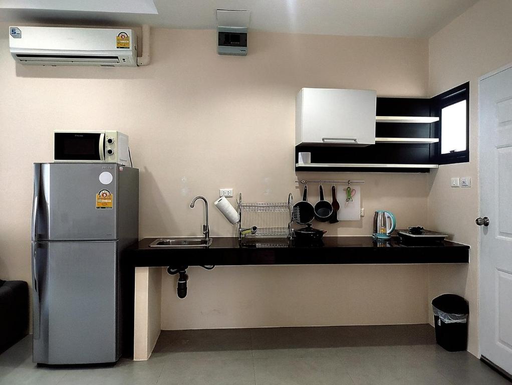 Kuchyň nebo kuchyňský kout v ubytování Villa LunaSole Samui