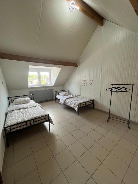 Postel nebo postele na pokoji v ubytování Chez Nadège