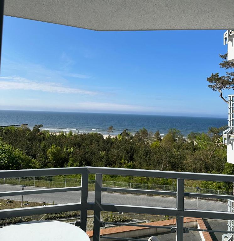 a view of the beach from a balcony at PRZY PLAŻY APARTAMENT 306 Porta Mare in Dziwnówek
