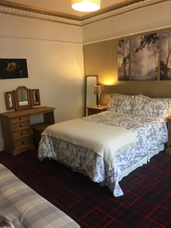 Postel nebo postele na pokoji v ubytování Tanglin Guest House