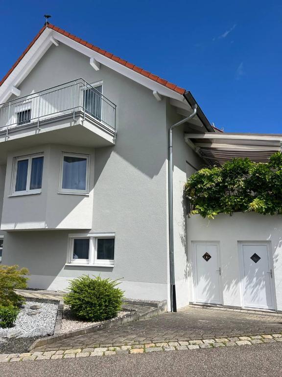 a white house with a white garage at Fewo Haus Ema in Lahr
