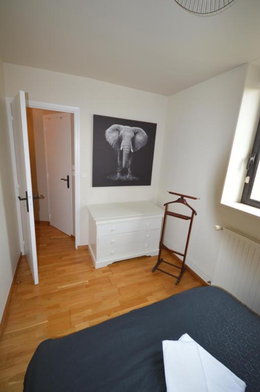 Postel nebo postele na pokoji v ubytování Logement cosy et moderne