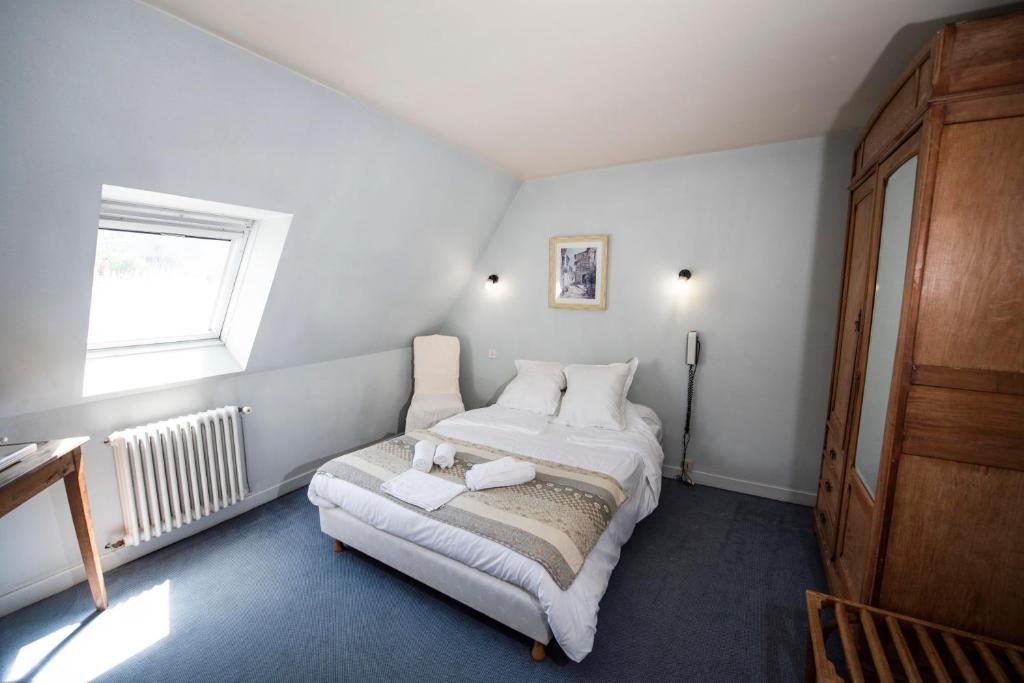 Postel nebo postele na pokoji v ubytování Hotel 1610