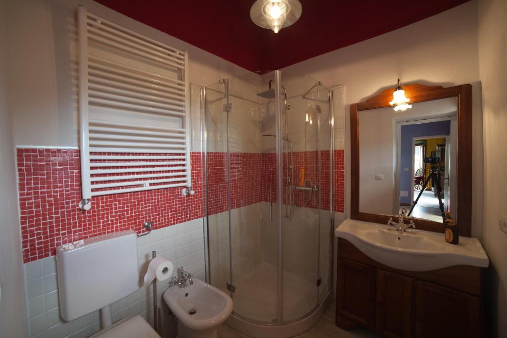 a bathroom with a shower and a sink and a toilet at All'Antico Convento in Cannero Riviera