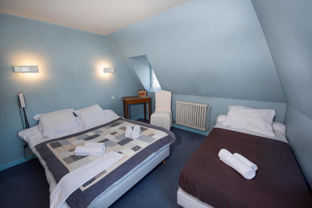 Postel nebo postele na pokoji v ubytování Hotel 1610