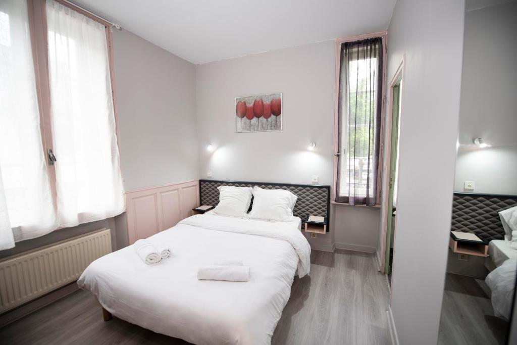 Postel nebo postele na pokoji v ubytování Hotel 1610