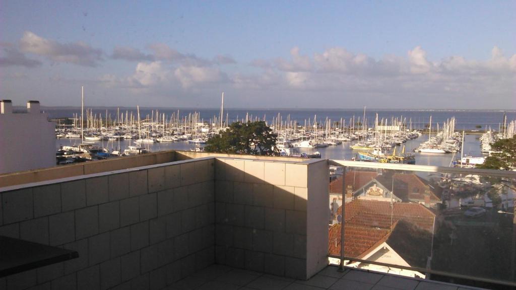 a view of a marina with boats in the water at Hôtel Le Nautic in Arcachon