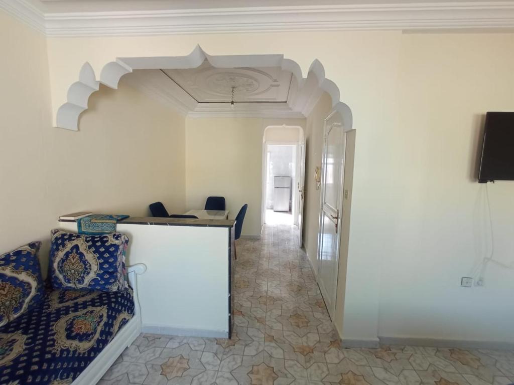 a living room with a couch and a table at Bilal appartement in Larache