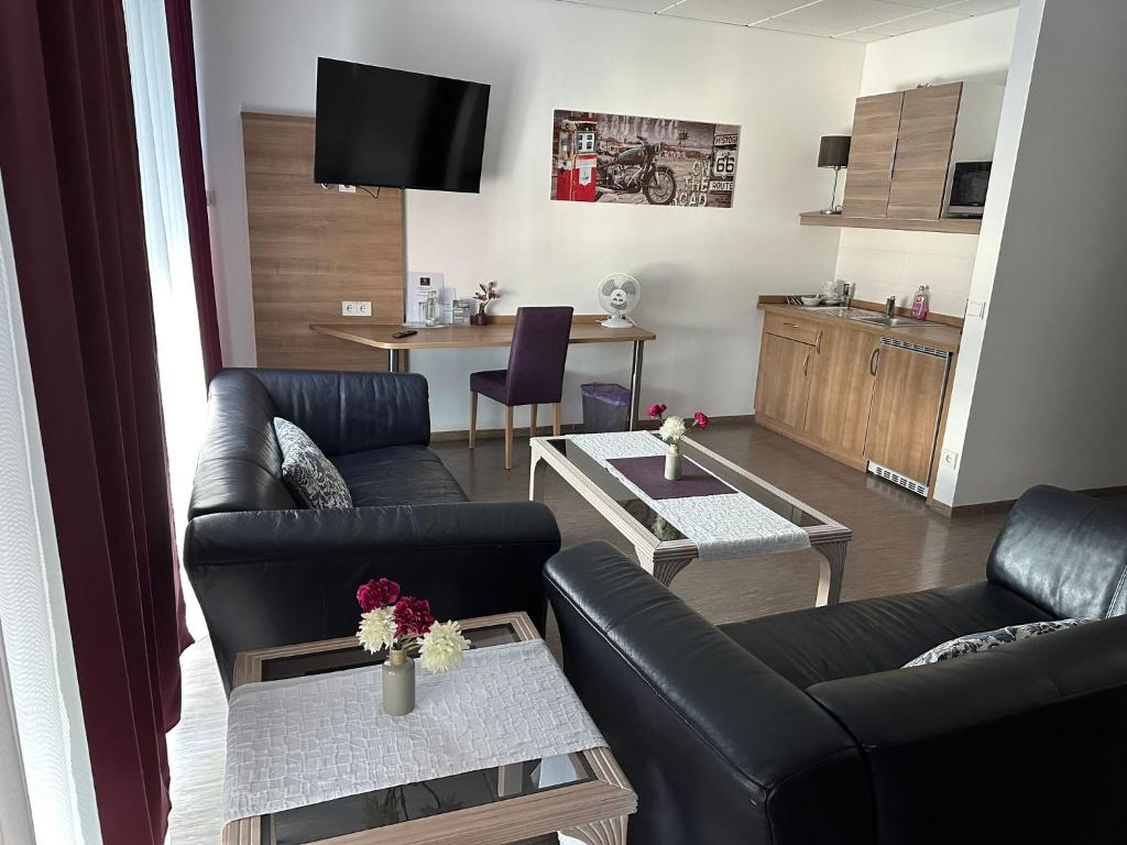 TV a/nebo společenská místnost v ubytování Hotel Efcannos