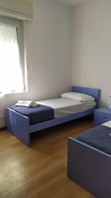 Postel nebo postele na pokoji v ubytování Villa Serena