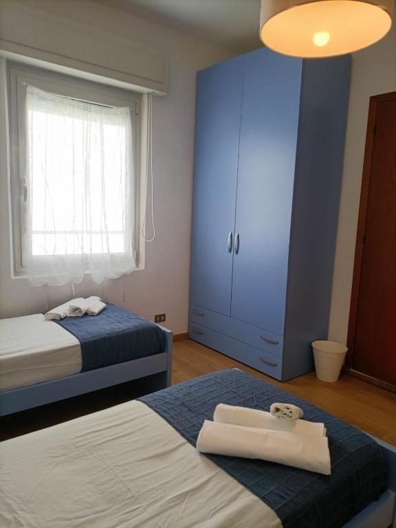 Postel nebo postele na pokoji v ubytování Villa Serena