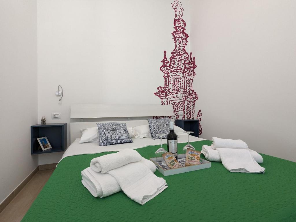 Postel nebo postele na pokoji v ubytování B&B EVO Nardò