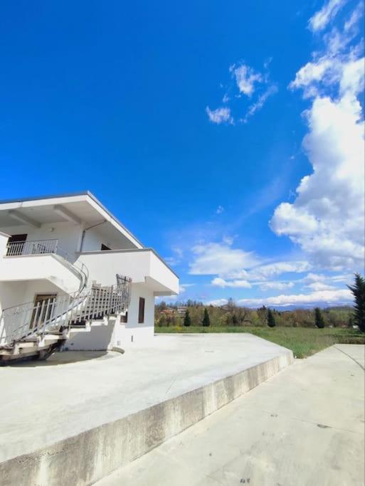 a white building with stairs on the side of it at Villa Verde in Ceccano