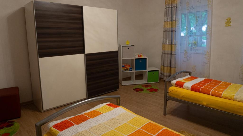 Postel nebo postele na pokoji v ubytování (W)einHaus am See
