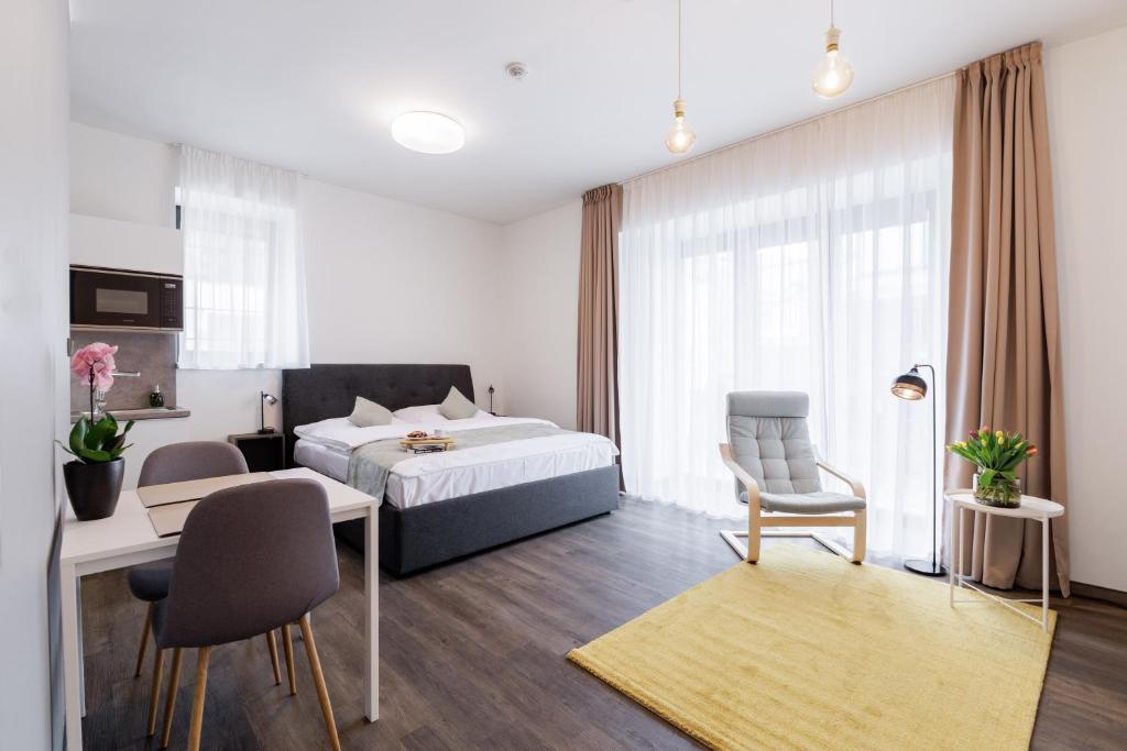 Postel nebo postele na pokoji v ubytování River Apartments