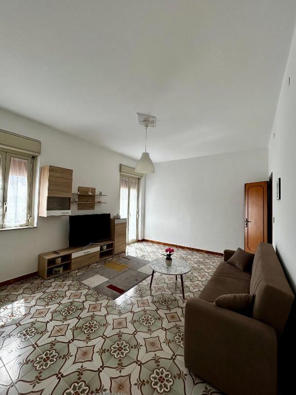 a living room with a couch and a table at GRC Apartments Partanna-Mondello in Palermo