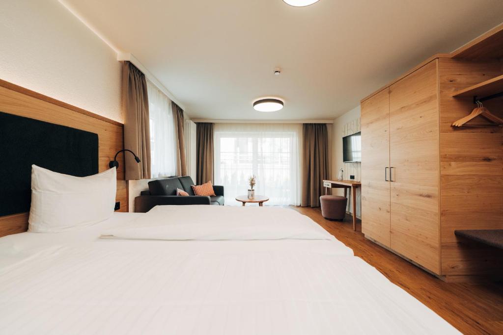 Postel nebo postele na pokoji v ubytování Hotel Tradizio