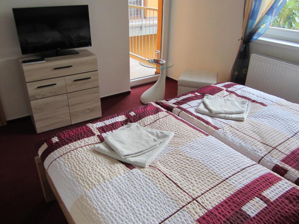 Postel nebo postele na pokoji v ubytování Guest House Krpole