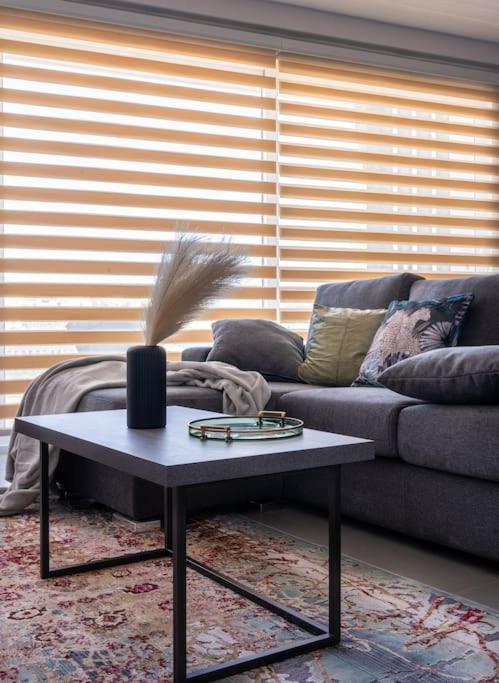 a living room with a couch and a coffee table at LA88 Cityway Apartment 5 in Il-Gżira
