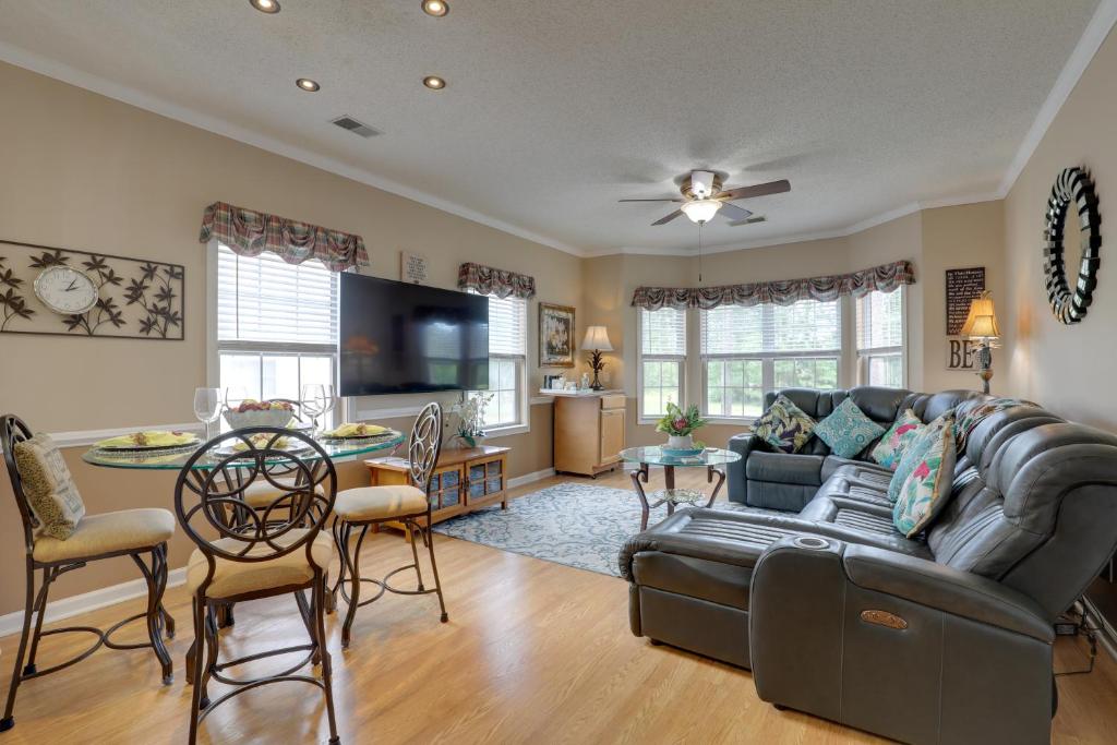 a living room with a couch and a table at Golf Getaway with Pool Access in Myrtle Beach! in Myrtle Beach